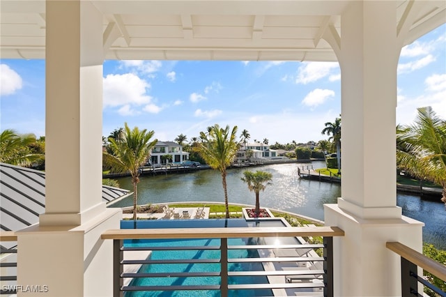 view of swimming pool with a water view