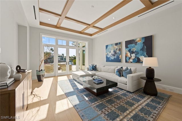 living room with coffered ceiling, beam ceiling, french doors, and light wood-type flooring