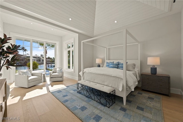bedroom featuring wood finished floors, baseboards, and recessed lighting
