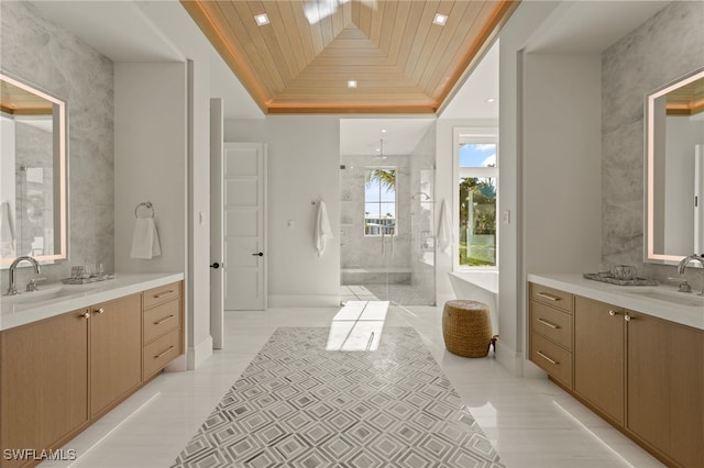 bathroom featuring wood ceiling, a shower stall, and two vanities
