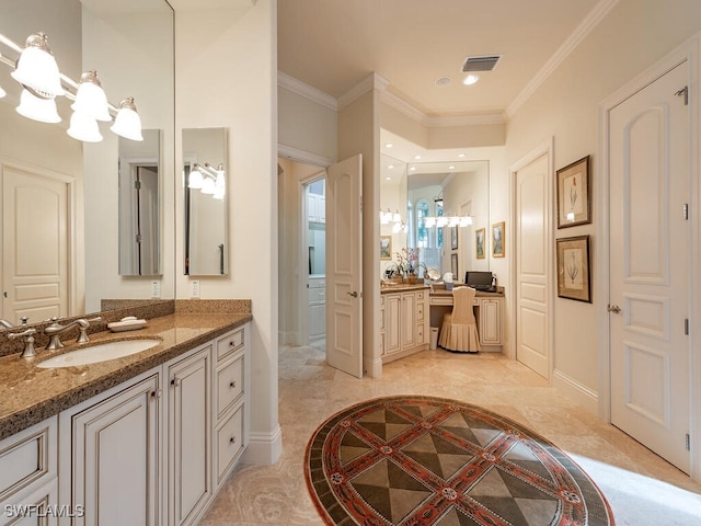 bathroom with an inviting chandelier, ornamental molding, and vanity