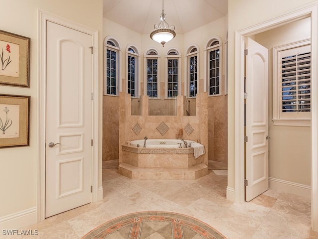 bathroom featuring a relaxing tiled tub