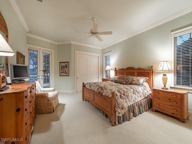 carpeted bedroom with french doors, a closet, crown molding, and access to exterior