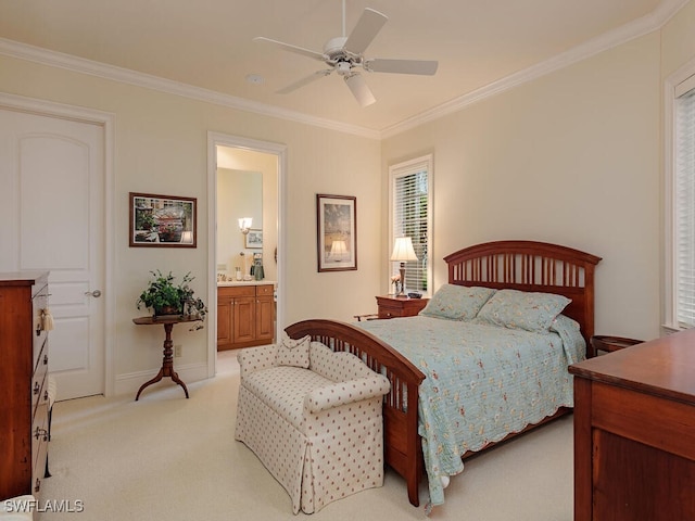 carpeted bedroom featuring ornamental molding, ceiling fan, and ensuite bath