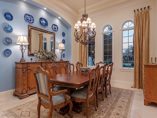 dining room featuring ornamental molding and a chandelier