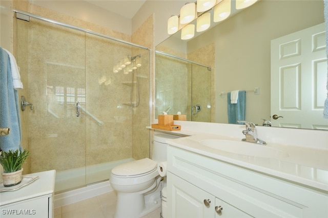 bathroom with tile patterned flooring, an enclosed shower, vanity, and toilet