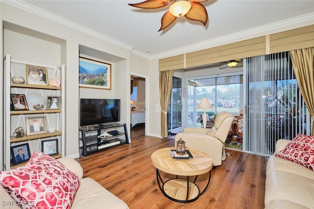 living room featuring ornamental molding and hardwood / wood-style floors