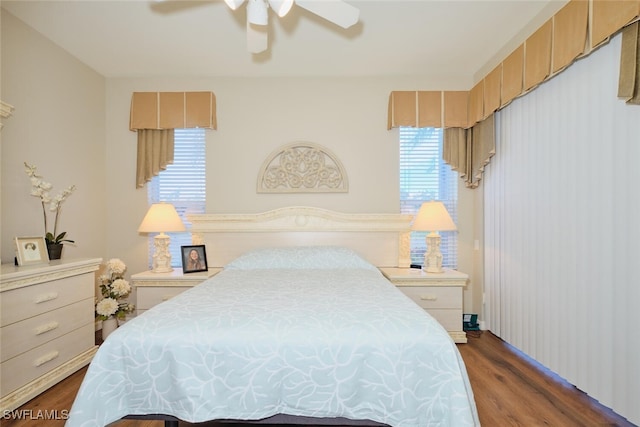 bedroom featuring dark hardwood / wood-style flooring and ceiling fan