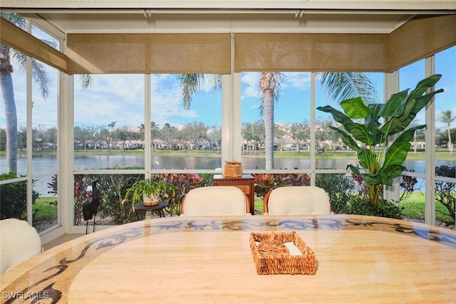 sunroom with a water view