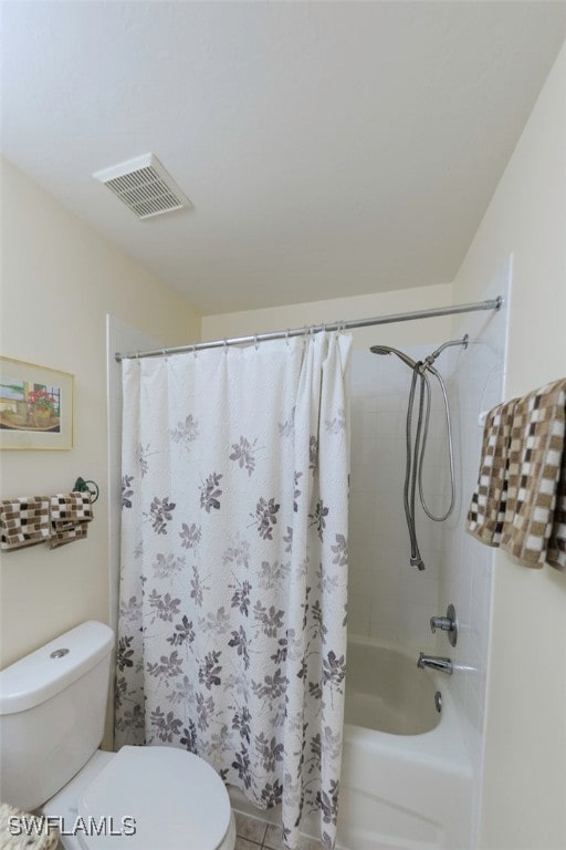 bathroom with shower / bathtub combination with curtain and toilet