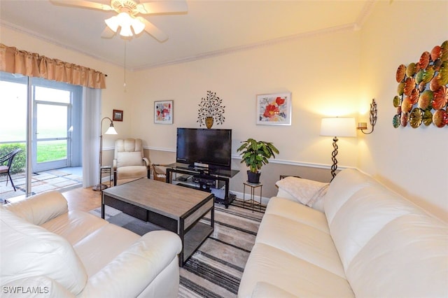 living room featuring ornamental molding and ceiling fan