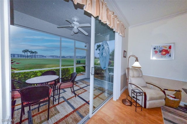 sunroom / solarium with ceiling fan