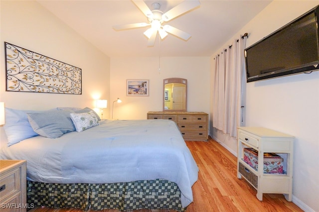 bedroom with ceiling fan and light hardwood / wood-style floors