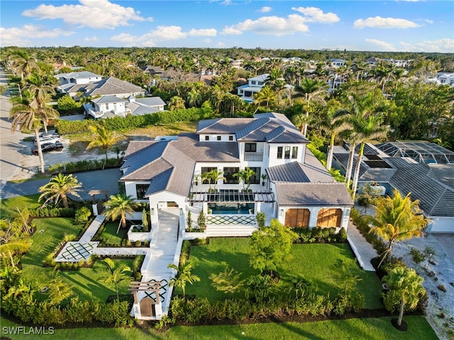 birds eye view of property with a residential view