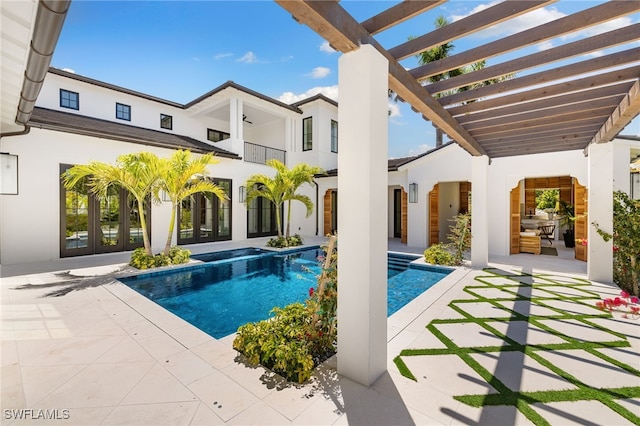 outdoor pool featuring french doors, a pergola, and a patio
