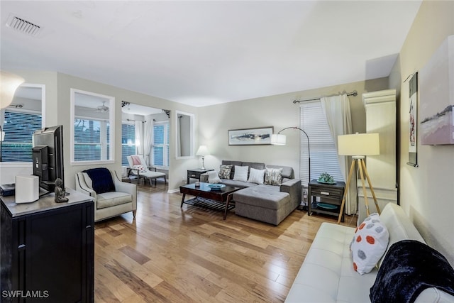 living room with light hardwood / wood-style flooring