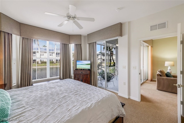 carpeted bedroom with ceiling fan and access to exterior