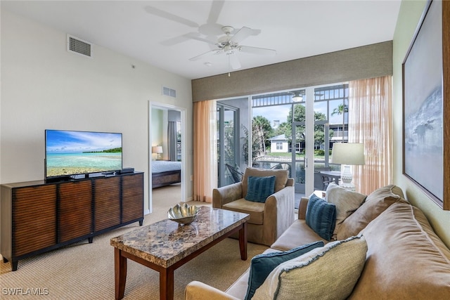 living room featuring ceiling fan and light carpet