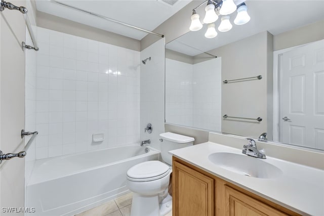 full bathroom featuring toilet, tiled shower / bath, tile patterned floors, and vanity