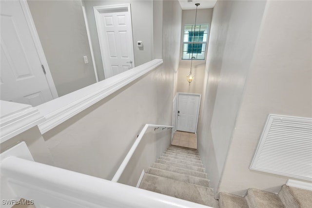 staircase with tile patterned flooring