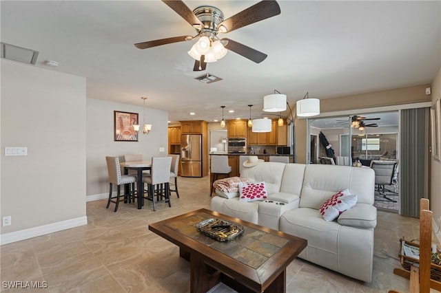 living room with ceiling fan