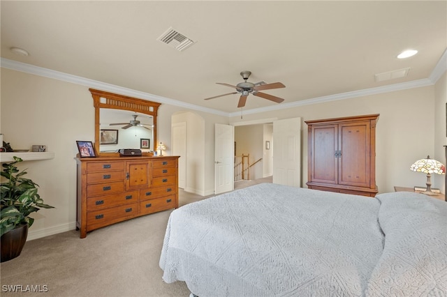 carpeted bedroom featuring ceiling fan and ornamental molding