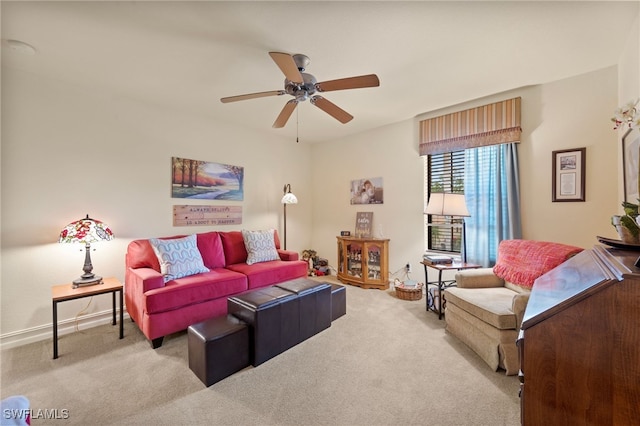 living room featuring ceiling fan and light colored carpet