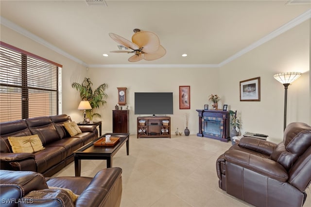 tiled living room with ceiling fan and ornamental molding