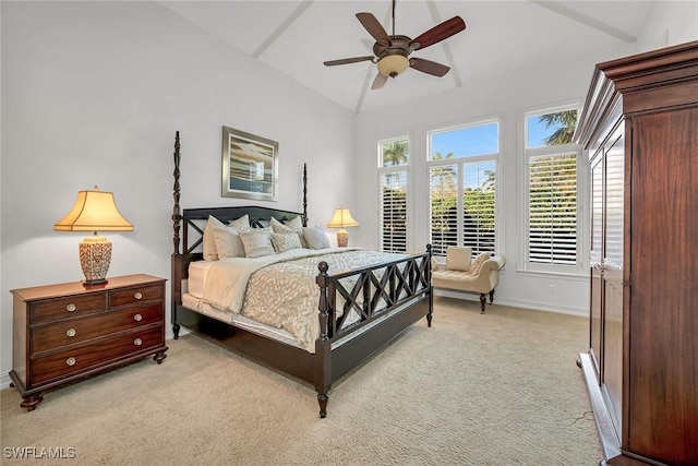 bedroom featuring lofted ceiling, a ceiling fan, baseboards, and light carpet