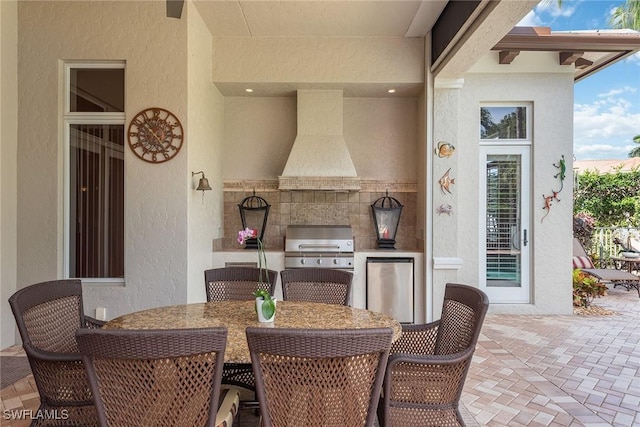 view of patio / terrace with area for grilling and outdoor dining area