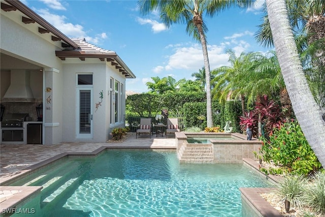 view of swimming pool featuring a fenced in pool, an in ground hot tub, a patio, and fence