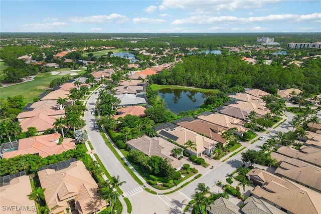 birds eye view of property with a water view and a residential view