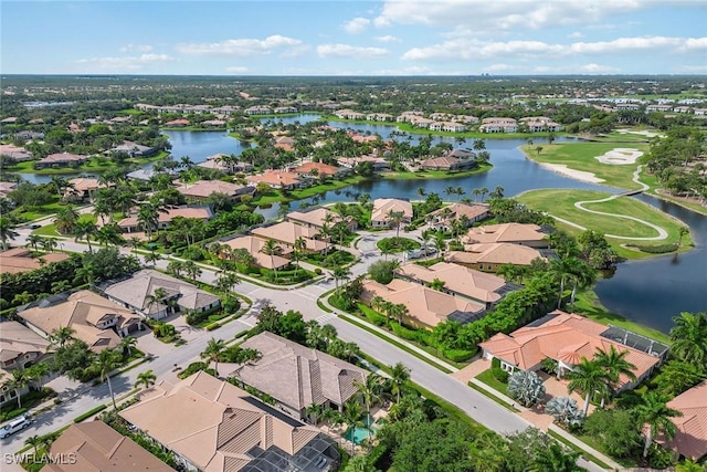 birds eye view of property with a residential view and a water view