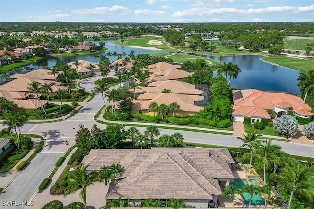 drone / aerial view featuring a water view and a residential view