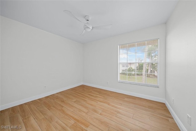 empty room featuring ceiling fan and light hardwood / wood-style floors