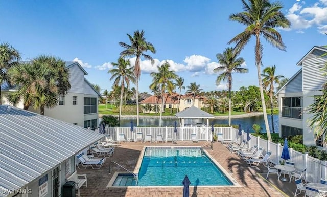 view of pool featuring a gazebo, a water view, and a patio