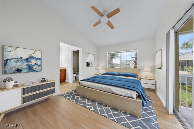 bedroom featuring access to exterior, light hardwood / wood-style floors, and multiple windows