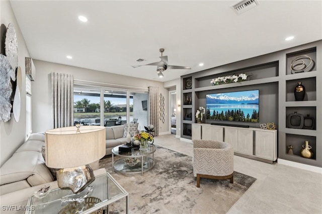 living room featuring built in shelves and ceiling fan