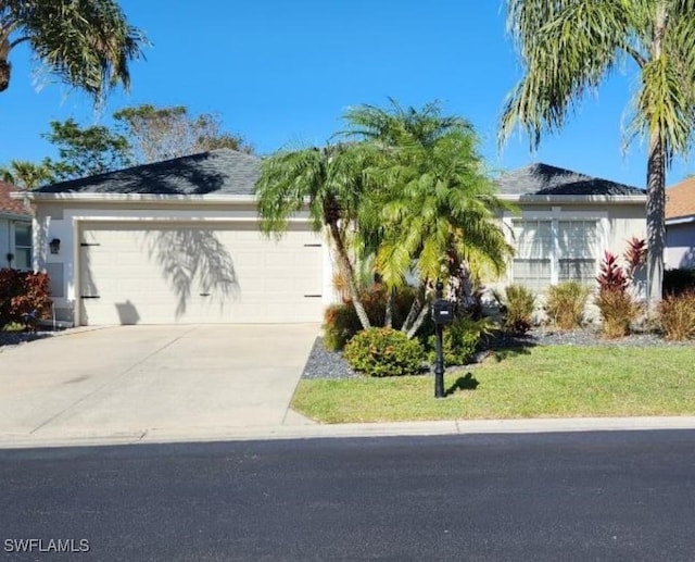 8884 Cedar Hollow Dr, Fort Myers, FL 33912 - view of front facade featuring a garage