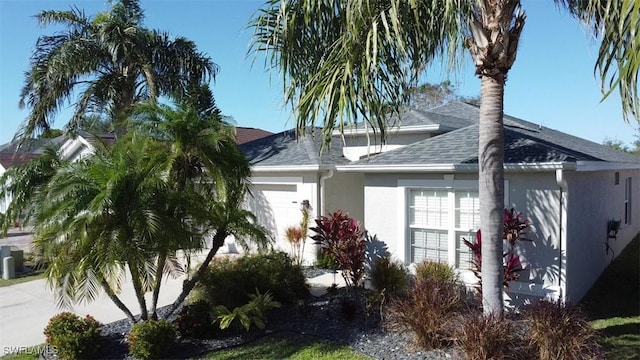 view of side of home featuring a garage