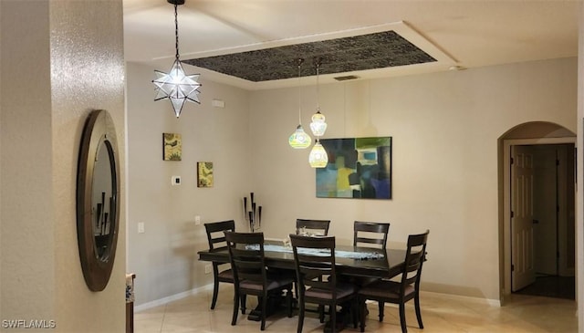 dining area featuring light tile patterned flooring