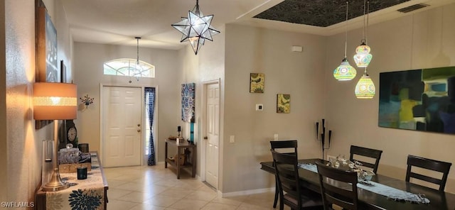 tiled entrance foyer with a high ceiling