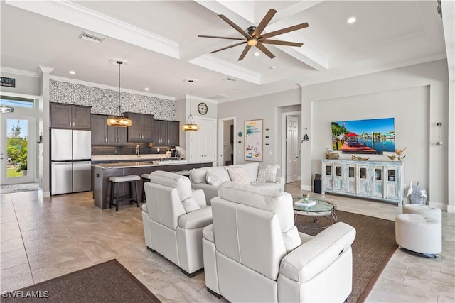 living room with ceiling fan, crown molding, beam ceiling, and coffered ceiling