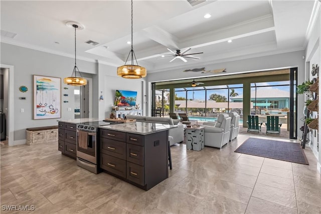 kitchen featuring light stone countertops, pendant lighting, ornamental molding, and stainless steel range with electric stovetop