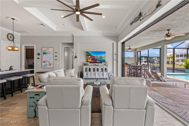 living room with a textured ceiling, light tile patterned floors, and ornamental molding