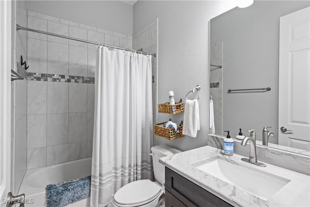 full bathroom featuring toilet, vanity, and shower / bath combo with shower curtain
