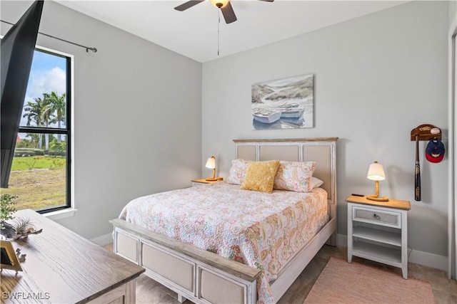 bedroom featuring ceiling fan and multiple windows