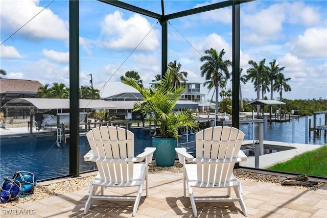 view of patio / terrace with glass enclosure, a water view, and a dock