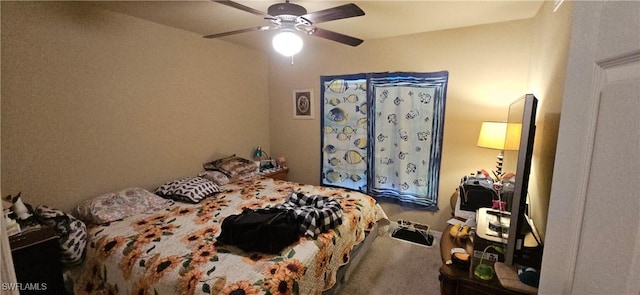 bedroom featuring ceiling fan and carpet