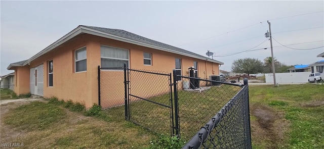 view of property exterior featuring cooling unit and a yard